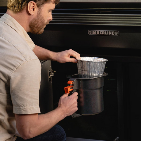 Traeger BAC608 Grease & Ash Keg Liner 5 Pack - Placing Liner in Timberline Grease & Ash Keg